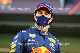 Sergio Perez (MEX) Red Bull Racing at a team photograph. 09.12.2021. Formula 1 World Championship, Rd 22, Abu Dhabi Grand Prix, Yas Marina Circuit, Abu Dhabi, Preparation Day.