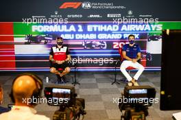 (L to R): Kimi Raikkonen (FIN) Alfa Romeo Racing and George Russell (GBR) Williams Racing in the FIA Press Conference. 09.12.2021. Formula 1 World Championship, Rd 22, Abu Dhabi Grand Prix, Yas Marina Circuit, Abu Dhabi, Preparation Day.