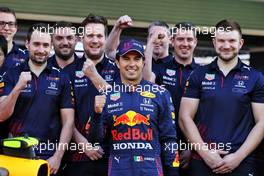 Sergio Perez (MEX) Red Bull Racing at a team photograph. 09.12.2021. Formula 1 World Championship, Rd 22, Abu Dhabi Grand Prix, Yas Marina Circuit, Abu Dhabi, Preparation Day.