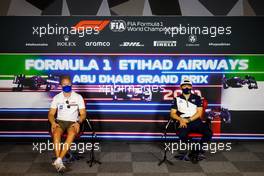 (L to R): Nikita Mazepin (RUS) Haas F1 Team and Yuki Tsunoda (JPN) AlphaTauri in the FIA Press Conference. 09.12.2021. Formula 1 World Championship, Rd 22, Abu Dhabi Grand Prix, Yas Marina Circuit, Abu Dhabi, Preparation Day.