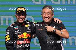 3rd place Sergio Perez (MEX) Red Bull Racing RB16B and Masashi Yamamoto (JPN) Honda Racing F1 Managing Director 24.10.2021. Formula 1 World Championship, Rd 17, United States Grand Prix, Austin, Texas, USA, Race Day.