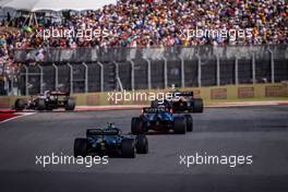 George Russell (GBR) Williams Racing FW43B leads Sebastian Vettel (GER) Aston Martin F1 Team AMR21. 24.10.2021. Formula 1 World Championship, Rd 17, United States Grand Prix, Austin, Texas, USA, Race Day.