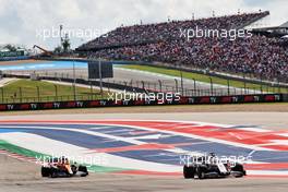 Nikita Mazepin (RUS) Haas F1 Team VF-21 and Daniel Ricciardo (AUS) McLaren MCL35M. 23.10.2021. Formula 1 World Championship, Rd 17, United States Grand Prix, Austin, Texas, USA, Qualifying Day.
