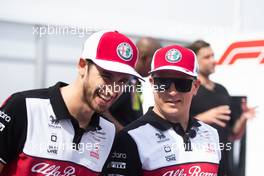 (L to R): Antonio Giovinazzi (ITA) Alfa Romeo Racing with team mate Kimi Raikkonen (FIN) Alfa Romeo Racing. 21.10.2021. Formula 1 World Championship, Rd 17, United States Grand Prix, Austin, Texas, USA, Preparation Day.