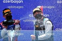 (L to R): Race winner Robert Shwartzman (RUS) PREMA Racing celebrates on the podium with third placed Guanyu Zhou (CHN) Uni-Virtuosi Racing. 05.06.2021. FIA Formula 2 Championship, Rd 3, Sprint Race 1, Baku, Azerbaijan, Saturday.