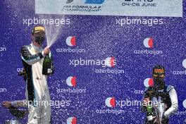 (L to R): Dan Ticktum (GBR) Carlin celebrates his second position on the podium. with third placed Guanyu Zhou (CHN) Uni-Virtuosi Racing. 05.06.2021. FIA Formula 2 Championship, Rd 3, Sprint Race 1, Baku, Azerbaijan, Saturday.