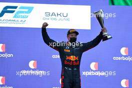 Race winner Juri Vips (EST) Hitech celebrates on the podium. 05.06.2021. FIA Formula 2 Championship, Rd 3, Sprint Race 2, Baku, Azerbaijan, Saturday.