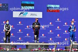 The podium (L to R): Oscar Piastri (AUS) PREMA Racing, second; Juri Vips (EST) Hitech, race winner; Robert Shwartzman (RUS) PREMA Racing, third. 06.06.2021. FIA Formula 2 Championship, Rd 3, Feature Race, Baku, Azerbaijan, Sunday.