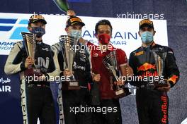 The podium (L to R): Guanyu Zhou (CHN) Uni-Virtuosi Racing, second; Oscar Piastri (AUS) PREMA Racing, race winner; Jehan Daruvala (IND) Carlin, third. 27.03.2021. FIA Formula 2 Championship, Rd 1, Sprint Race 2, Sakhir, Bahrain, Saturday.