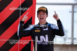 Race winner Guanyu Zhou (CHN) Uni-Virtuosi Racing celebrates on the podium. 18.07.2021. FIA Formula 2 Championship, Rd 4, Feature Race, Silverstone, England, Sunday.