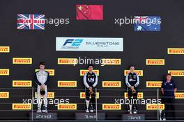 The podium (L to R): Dan Ticktum (GBR) Carlin, second; Guanyu Zhou (CHN) Uni-Virtuosi Racing, race winner; Oscar Piastri (AUS) PREMA Racing, third. 18.07.2021. FIA Formula 2 Championship, Rd 4, Feature Race, Silverstone, England, Sunday.