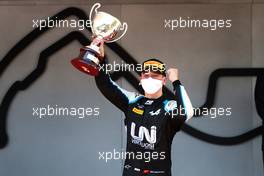 Race winner Guanyu Zhou (CHN) Uni-Virtuosi Racing celebrates on the podium. 21.05.2021. FIA Formula 2 Championship, Rd 2, Sprint Race 1, Monte Carlo, Monaco, Friday.