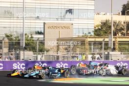 Marcus Armstrong (NZL) Dams and Liam Lawson (NZL) Hitech battle for the lead at the start of the race. 04.12.2021. FIA Formula 2 Championship, Rd 7, Sprint Race 1, Jeddah, Saudi Arabia, Saturday.