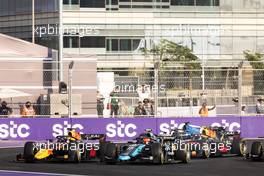 Marcus Armstrong (NZL) Dams and Liam Lawson (NZL) Hitech battle for the lead at the start of the race. 04.12.2021. FIA Formula 2 Championship, Rd 7, Sprint Race 1, Jeddah, Saudi Arabia, Saturday.