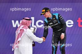Race winner Marcus Armstrong (NZL) Dams celebrates on the podium. 04.12.2021. FIA Formula 2 Championship, Rd 7, Sprint Race 1, Jeddah, Saudi Arabia, Saturday.