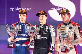 The podium (L to R): Robert Shwartzman (RUS) PREMA Racing, second; Oscar Piastri (AUS) PREMA Racing, race winner; Ralph Boschung (SUI) Campos Racing, third. 05.12.2021. FIA Formula 2 Championship, Rd 7, Feature Race, Jeddah, Saudi Arabia, Sunday.