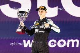 Race winner Oscar Piastri (AUS) PREMA Racing celebrates on the podium. 05.12.2021. FIA Formula 2 Championship, Rd 7, Feature Race, Jeddah, Saudi Arabia, Sunday.
