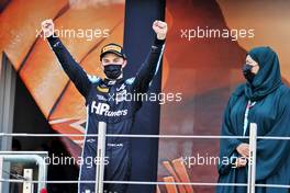 Oscar Piastri (AUS) PREMA Racing celebrates third position and the F2 Championship on the podium. 11.12.2021. Formula 2 Championship, Rd 8, Yas Marina Circuit, Abu Dhabi, UAE, Sprint Race 1, Saturday.