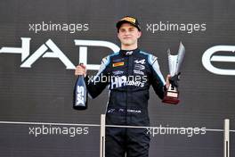 Oscar Piastri (AUS) Alpine Academy Driver celebrates third place and the F2 Championship on the podium. 11.12.2021. Formula 2 Championship, Rd 8, Yas Marina Circuit, Abu Dhabi, UAE, Sprint Race 1, Saturday.
