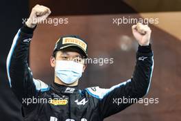 Race winner Guanyu Zhou (CHN) Uni-Virtuosi Racing celebrates on the podium. 11.12.2021. Formula 2 Championship, Rd 8, Yas Marina Circuit, Abu Dhabi, UAE, Sprint Race 2, Saturday.