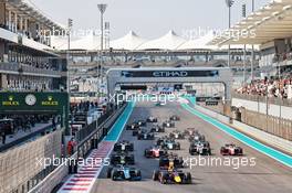 Jehan Daruvala (IND) Carlin leads Felipe Drugovich (BRA) Uni-Virtuosi Racing at the start of the race. 11.12.2021. Formula 2 Championship, Rd 8, Yas Marina Circuit, Abu Dhabi, UAE, Sprint Race 1, Saturday.