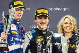 The podium (L to R): Robert Shwartzman (RUS) PREMA Racing, Guanyu Zhou (CHN) Uni-Virtuosi Racing, race winner. 11.12.2021. Formula 2 Championship, Rd 8, Yas Marina Circuit, Abu Dhabi, UAE, Sprint Race 2, Saturday.