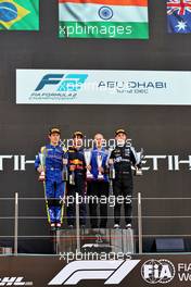 The podium (L to R): Felipe Drugovich (BRA) Uni-Virtuosi Racing, second; Jehan Daruvala (IND) Carlin, race winner; Oscar Piastri (AUS) PREMA Racing, third and F2 Champion. 11.12.2021. Formula 2 Championship, Rd 8, Yas Marina Circuit, Abu Dhabi, UAE, Sprint Race 1, Saturday.