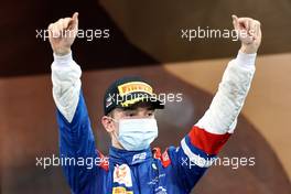 Robert Shwartzman (RUS) PREMA Racing celebrates his second position on the podium. 11.12.2021. Formula 2 Championship, Rd 8, Yas Marina Circuit, Abu Dhabi, UAE, Sprint Race 2, Saturday.