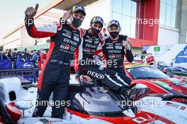 (L to R): Race winners Brendon Hartley (NZL); Sebastien Buemi (SUI); and Kazuki Nakajima (JPN) #08 Toyota Racing, Toyota GR010, Hybrid, celebrate in parc ferme. 13.06.2021. FIA World Endurance Championship, Rd 2, Portimao, Portugal.