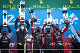 (L to R): race winners #07 Toyota Gazoo Racing Mike Conway (GBR); Kamui Kobayashi (JPN); and Jose Maria Lopez (ARG), celebrate on the podium. 22.08.2021. FIA World Endurance Championship, Le Mans 24 Hour Race, Le Mans, France, Sunday.