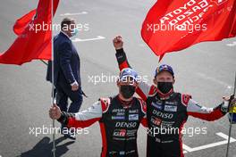 (L to R): Race winners Jose Maria Lopez (ARG) and Mike Conway (GBR) #07 Toyota Gazoo Racing Toyota GR010 Hybrid celebrate in parc ferme. 22.08.2021. FIA World Endurance Championship, Le Mans 24 Hour Race, Le Mans, France, Sunday.