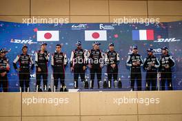 The podium (L to R): Kazuki Nakajima (JPN), Brendon Hartley (NZL), and Sebastien Buemi (SUI) #08 Toyota Racing, second; Jose Maria Lopez (ARG), Mike Conway (GBR), and Kamui Kobayashi (JPN) #07 Toyota Gazoo Racing, race winners; Mathieu Vaxiviere (FRA), Nicolas Lapierre (FRA), Andre Negrao (BRA) #36 Alpine Elf Matmut, third.  30.10.2021. FIA World Endurance Championship, Round 5, Six Hours of Bahrain, Sakhir, Bahrain, Saturday.