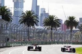 (L to R): Max Verstappen (NLD) Red Bull Racing RB18 and Guanyu Zhou (CHN) Alfa Romeo F1 Team C42. 08.04.2022. Formula 1 World Championship, Rd 3, Australian Grand Prix, Albert Park, Melbourne, Australia, Practice Day.