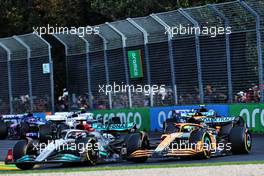 George Russell (GBR) Mercedes AMG F1 W13 and Lando Norris (GBR) McLaren MCL36 at the start of the race. 10.04.2022. Formula 1 World Championship, Rd 3, Australian Grand Prix, Albert Park, Melbourne, Australia, Race Day.