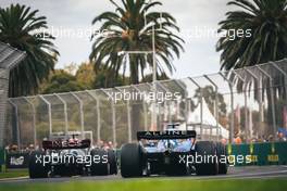 George Russell (GBR) Mercedes AMG F1 W13 and Fernando Alonso (ESP) Alpine F1 Team A522. 09.04.2022. Formula 1 World Championship, Rd 3, Australian Grand Prix, Albert Park, Melbourne, Australia, Qualifying Day.