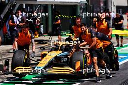 The McLaren MCL36 of Lando Norris (GBR) McLaren is recovered back to the pits by mechanics. 08.07.2022. Formula 1 World Championship, Rd 11, Austrian Grand Prix, Spielberg, Austria, Qualifying Day.