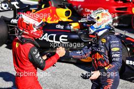 Max Verstappen (NLD) Red Bull Racing (Right) celebrates being fastest in qualifying in parc ferme with Charles Leclerc (MON) Ferrari. 08.07.2022. Formula 1 World Championship, Rd 11, Austrian Grand Prix, Spielberg, Austria, Qualifying Day.