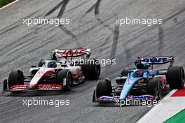 Mick Schumacher (GER) Haas VF-22 and Fernando Alonso (ESP) Alpine F1 Team A522 battle for position. 10.07.2022. Formula 1 World Championship, Rd 11, Austrian Grand Prix, Spielberg, Austria, Race Day.