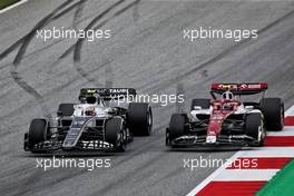(L to R): Yuki Tsunoda (JPN) AlphaTauri AT03 and Guanyu Zhou (CHN) Alfa Romeo F1 Team C42 battle for position. 10.07.2022. Formula 1 World Championship, Rd 11, Austrian Grand Prix, Spielberg, Austria, Race Day.