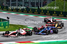 Kevin Magnussen (DEN) Haas VF-22; Fernando Alonso (ESP) Alpine F1 Team A522; and Guanyu Zhou (CHN) Alfa Romeo F1 Team C42, battle for position. 10.07.2022. Formula 1 World Championship, Rd 11, Austrian Grand Prix, Spielberg, Austria, Race Day.