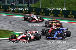 Kevin Magnussen (DEN) Haas VF-22; Fernando Alonso (ESP) Alpine F1 Team A522; and Guanyu Zhou (CHN) Alfa Romeo F1 Team C42, battle for position. 10.07.2022. Formula 1 World Championship, Rd 11, Austrian Grand Prix, Spielberg, Austria, Race Day.