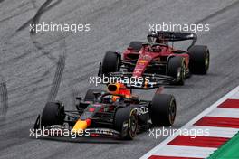 Max Verstappen (NLD) Red Bull Racing RB18 leads Charles Leclerc (MON) Ferrari F1-75. 10.07.2022. Formula 1 World Championship, Rd 11, Austrian Grand Prix, Spielberg, Austria, Race Day.