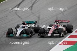 George Russell (GBR) Mercedes AMG F1 W13 and Valtteri Bottas (FIN) Alfa Romeo F1 Team C42 battle for position. 10.07.2022. Formula 1 World Championship, Rd 11, Austrian Grand Prix, Spielberg, Austria, Race Day.