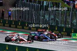(L to R): Kevin Magnussen (DEN) Haas VF-22; Fernando Alonso (ESP) Alpine F1 Team A522; and Guanyu Zhou (CHN) Alfa Romeo F1 Team C42, battle for position. 10.07.2022. Formula 1 World Championship, Rd 11, Austrian Grand Prix, Spielberg, Austria, Race Day.