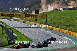 Daniel Ricciardo (AUS) McLaren MCL36 and Yuki Tsunoda (JPN) AlphaTauri AT03 at the start. 09.07.2022. Formula 1 World Championship, Rd 11, Austrian Grand Prix, Spielberg, Austria, Sprint Day.