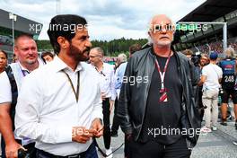 (L to R): Mohammed Bin Sulayem (UAE) FIA President with Flavio Briatore (ITA) on the grid. 09.07.2022. Formula 1 World Championship, Rd 11, Austrian Grand Prix, Spielberg, Austria, Sprint Day.