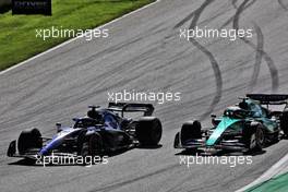 Alexander Albon (THA) Williams Racing FW44 and Sebastian Vettel (GER) Aston Martin F1 Team AMR22 battle for position. 09.07.2022. Formula 1 World Championship, Rd 11, Austrian Grand Prix, Spielberg, Austria, Sprint Day.
