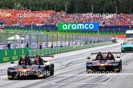 Max Verstappen (NLD) Red Bull Racing and Sergio Perez (MEX) Red Bull Racing on the drivers parade in KTM X-Bows. 10.07.2022. Formula 1 World Championship, Rd 11, Austrian Grand Prix, Spielberg, Austria, Race Day.