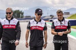 Guanyu Zhou (CHN) Alfa Romeo F1 Team walks the circuit with the team. 07.07.2022. Formula 1 World Championship, Rd 11, Austrian Grand Prix, Spielberg, Austria, Preparation Day.