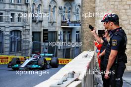 Circuit atmosphere - Police watch George Russell (GBR) Mercedes AMG F1 W13. 10.06.2022. Formula 1 World Championship, Rd 8, Azerbaijan Grand Prix, Baku Street Circuit, Azerbaijan, Practice Day.
